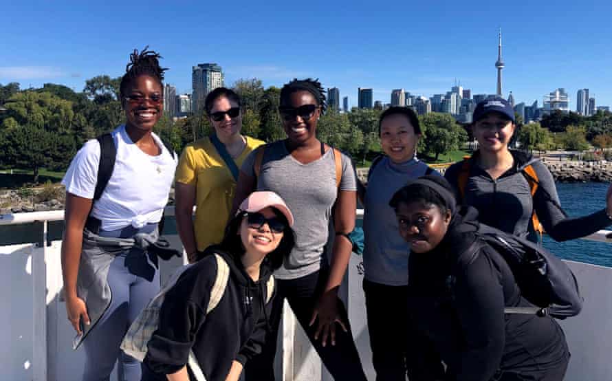 A group of people on a city hike in Toronto