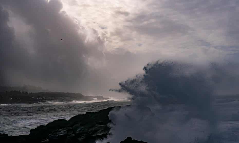 Heavy waves break against the Oregon coast as a ‘bomb cyclone’ storm system moves across Depoe Bay, Oregon.