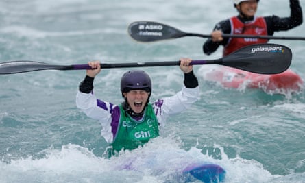 Kimberley Woods of Great Britain celebrates winning the gold medal in the final of the womens kayak cross during day six of the ICF Canoe Slalom World Championships 2023 at the Lee Valley White Water Centre.