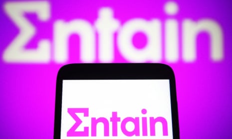 An Entain logo is seen on a smartphone