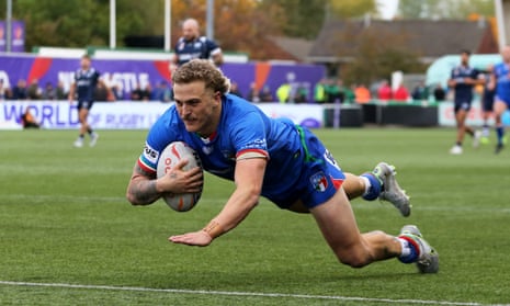 Jake Maizen goes over to score Italy's fifth try and his hat trick during their Rugby League World Cup match against Scotland.