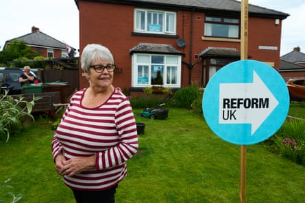 Pam Flaherty and her husband, Ian, in their garden at Ashton-in-Makerfield