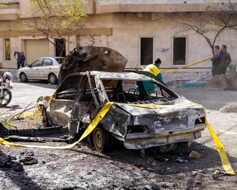 A burned out car in Tehran