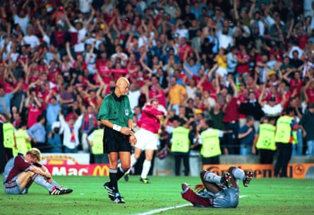 Referee Pierluigi Collina checks on Sammy Kuffour after Manchester United stun Bayern Munich in the dying moments of the 1999 Champions League final