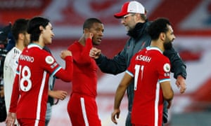 Premier League - Liverpool v Arsenal<br>Soccer Football - Premier League - Liverpool v Arsenal - Anfield, Liverpool, Britain - September 28, 2020. Liverpool's Takumi Minamino with manager Juergen Klopp after the match Pool via REUTERS/Jason Cairnduff EDITORIAL USE ONLY. No use with unauthorized audio, video, data, fixture lists, club/league logos or 'live' services. Online in-match use limited to 75 images, no video emulation. No use in betting, games or single club /league/player publications. Please contact your account representative for further details.