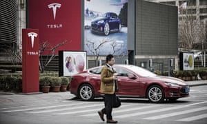 Electric cars, like this in Beijing, could become more common in the region