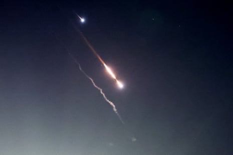 Projectiles are seen in the sky above Jerusalem after Iran launched drones and missiles towards Israel. US and UK forces  helped shoot down Iranian drones in the Middle East early on Sunday.