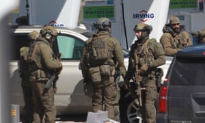Canada shooting: armed police at the gas station near Halifax, Nova Scotia, where Gabriel Wortman was pronounced dead after a standoff on Sunday.
