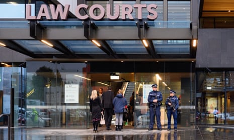 Police stand in front of Christchurch high court on Friday as the accused gunman of the mosque massacre faced friends and families of victims.