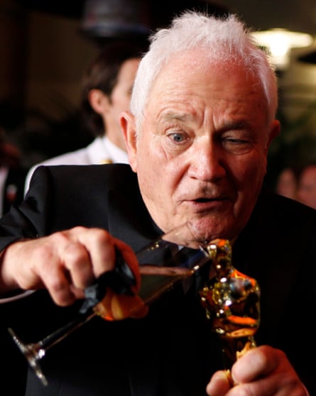 Taste of victory … David Seidler gives his Oscar statuette a drink of champagne after The King’s Speech sweeps the 2011 Oscars.