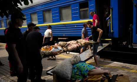 Patients board a medical evacuation train in Pokrovsk, eastern Ukraine, on Sunday