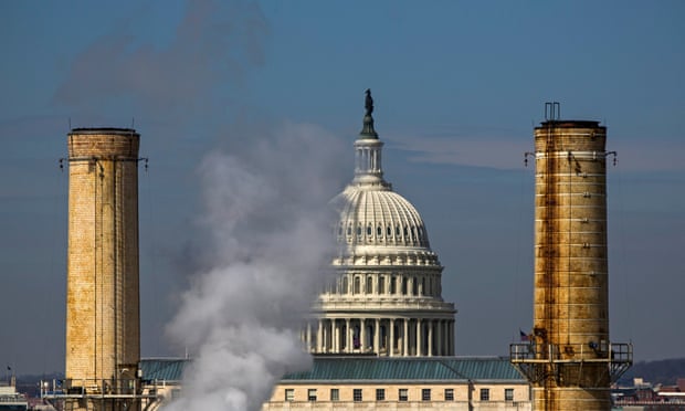 The dome of the US Capitol is seen behind the smokestacks of the Capitol Power Plant, the only fossil-fuel-burning power plant in the District of Columbia.
