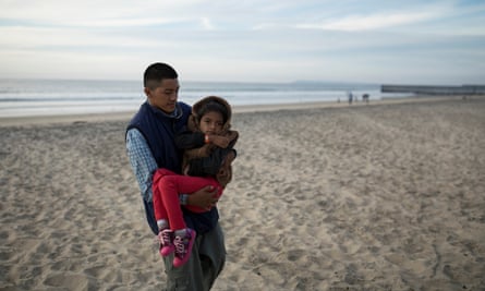 Juan and Lesly on the beach near the fence in Tijuana, where Lesly saw the sea for the first time. She was very excited and couldn’t stop looking at the ocean.