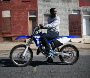 Pausing briefly on the Baltimore block where he used to hustle, Jules ‘Beeper’ Perry keeps an eye out for the police