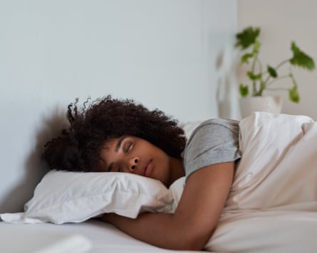Young woman asleep in her bed.