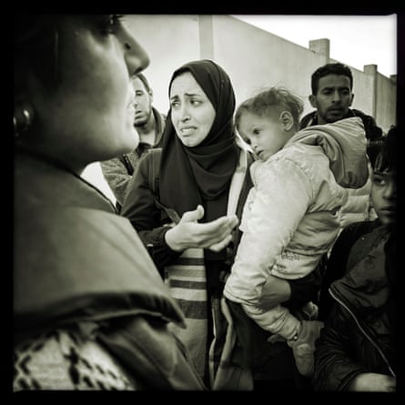 Ruba Farah talks with displaced families