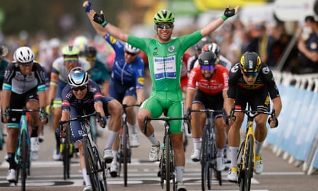 Mark Cavendish celebrates as he crosses the finish line in Valence. 
