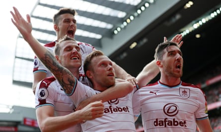 Scott Arfield, centre, celebrates his goal to open the scoring for Burnley at Anfield.