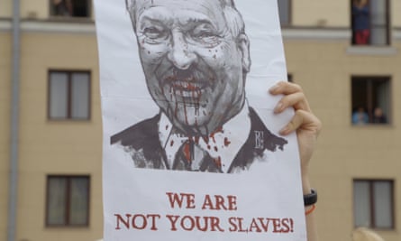 Protesters in Minsk, holding up an image of President Lukashenko.