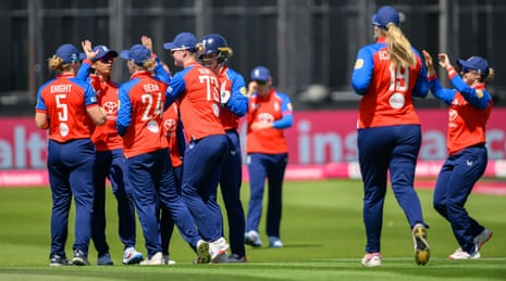 England Women celebrates their first wicket.