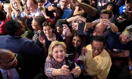 Democratic presidential nominee Hillary Clinton takes a selfie with supporters on Friday in Fort Pierce, Florida.