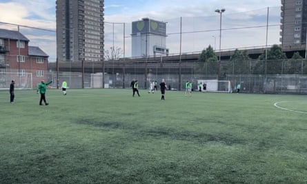 Football pitch with tower blocks in the background