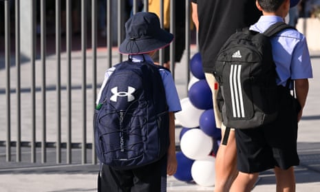 Students return to school on the first day of term one
