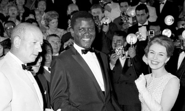 Sidney Poitier appears at the Cannes Film Festival, for the showing of his film A Raisin in the Sun, alongside Jean Seberg in 1961.