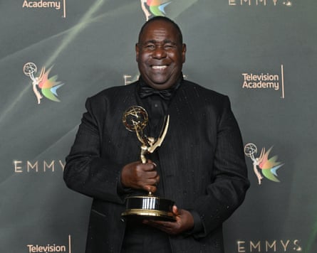 Ernest Harden Jr poses with his Emmy for outstanding guest actor in a drama series for The Pitt.