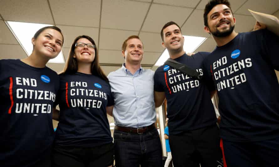 Dan McCready, Democratic candidate in the special election for North Carolina’s ninth congressional district, poses with volunteers at his campaign headquarters on election day, in Charlotte, North Carolina, in September 2019. He lost.