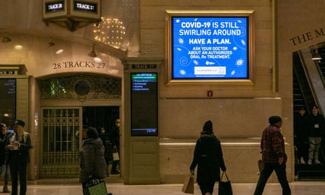 a covid information poster at grand central station