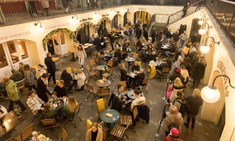 People dining in a restaurant in Covent Garden, London.