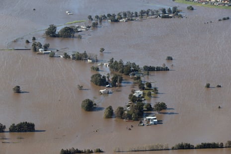Flooding is shown by helicopter on a tour of the Hunter region around Maitland. Trees and houses are seemingly isolated in high flood waters