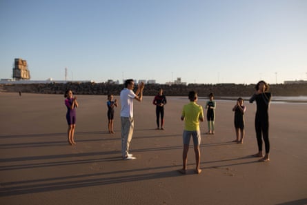 Salim and M’barek on beach with six children