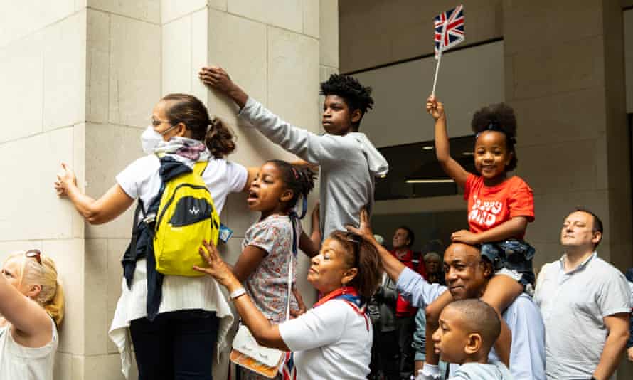 Beverly and Noel Chung and their grandchildren watch the parade and events at St Paul’s.