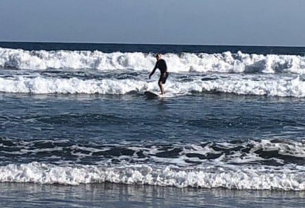 Duff Armour surfing.