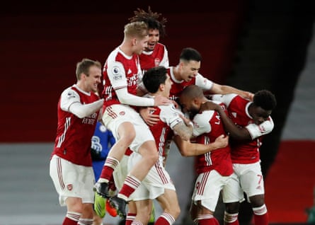 Arsenal’s players celebrate a victory over Chelsea in December 2020