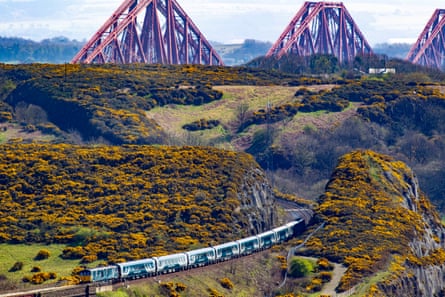 The new Caledonian Sleeper, with the Forth Rail Bridge in the background.