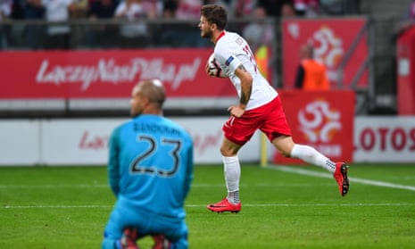 Mateusz Klich takes the ball back to the centre circle after his late equaliser for Poland.