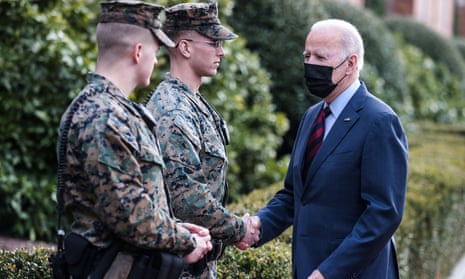 Joe Biden greets US Marines outside the Marine Barracks as he makes a surprise walk down Barracks Row in Washington, DC, this afternoon. Biden also did a spot of shopping at small business ‘Honey Made’ in the District.