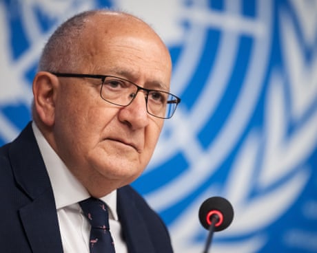 Chris Sidoti speaks in front of a UN sign. He says the Gaza genocide is unique