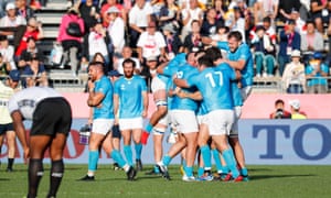 Uruguay players celebrate after winning against Fiji in Kamaishi.