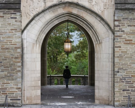 a student walks on a university campus