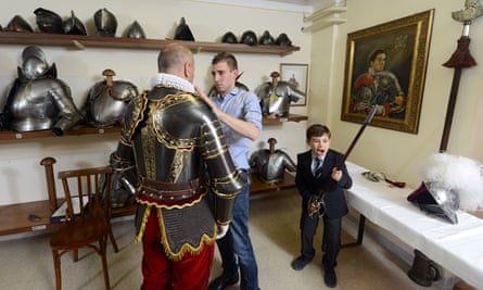 Christoph Graf, the 35th commander of the Pontifical Swiss Guard, is dressed as his son plays.