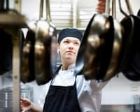 Male chef arranging frying pan in commercial kitchenGettyImages-724230177