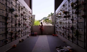 A woman at a Hong Kong columbarium during the Qingming festival, or tomb-sweeping day.