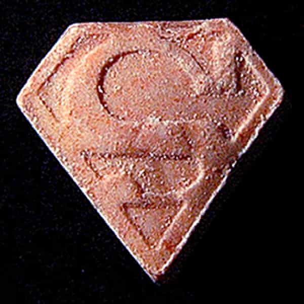 An ecstasy pill with a Superman-style logo.