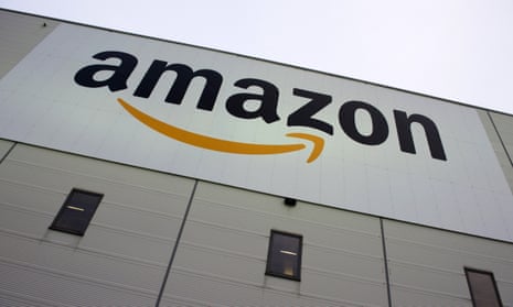 Amazon logo on the exterior of a warehouse.