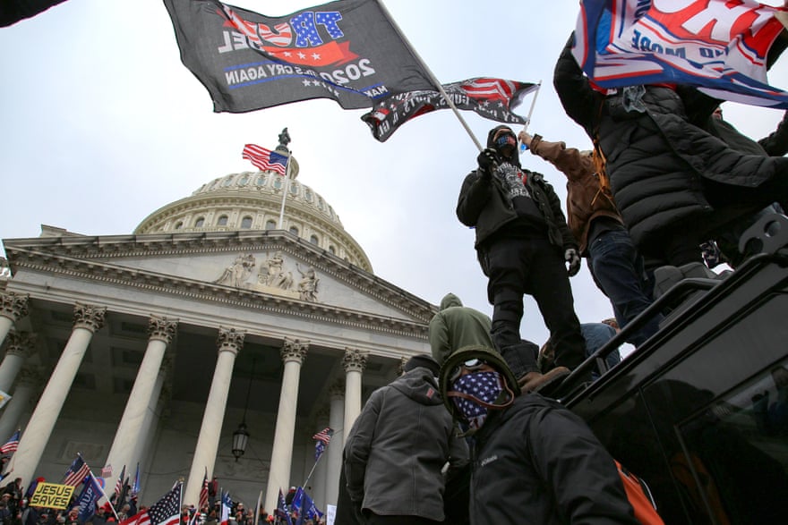 Supporters of Donald Trump surround and storm the US Capitol on 6 January.