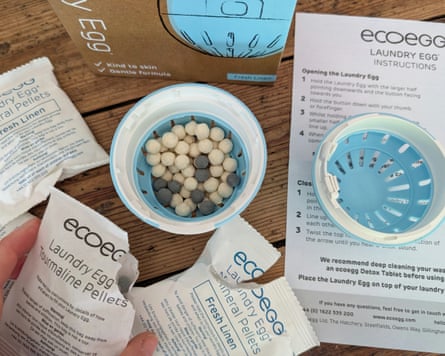 An open Ecoegg showing mineral tourmaline balls with instructions leaflet